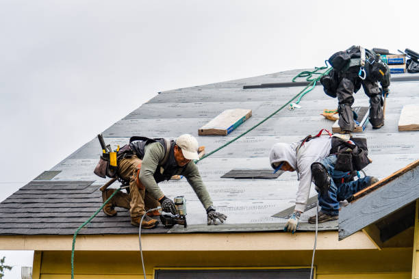 Professional Roofing technician working in South Beach, OR